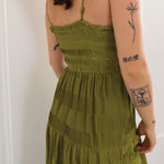 green midi dress with pleat detailing